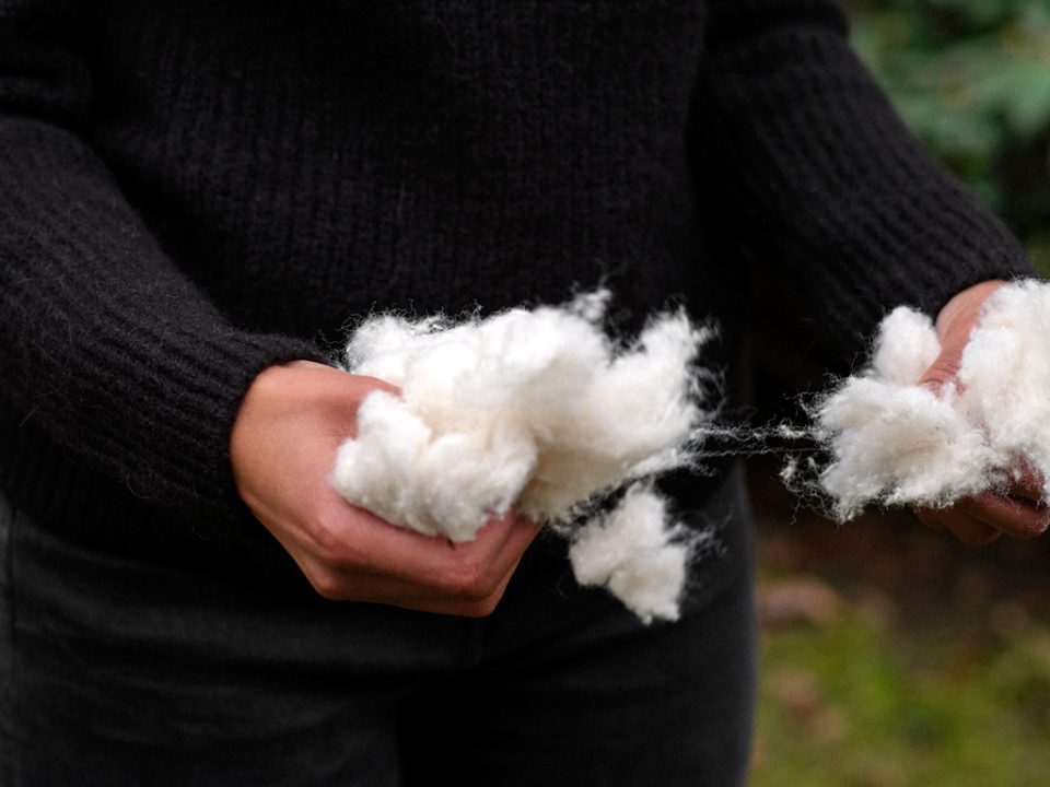 Close-up of raw cotton fibers, representing H&M Group's focus on sustainable and natural materials