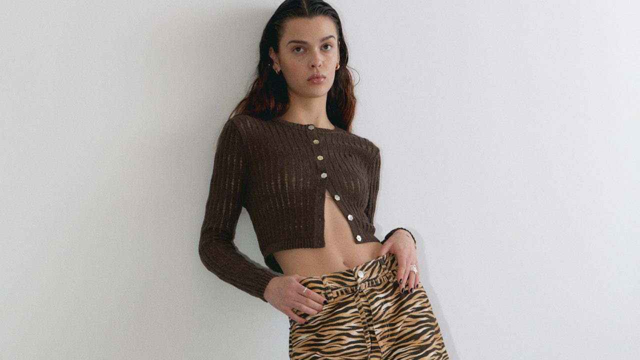 Monki brand campaign promoting model wearing bold, expressive fashion with playful energy.